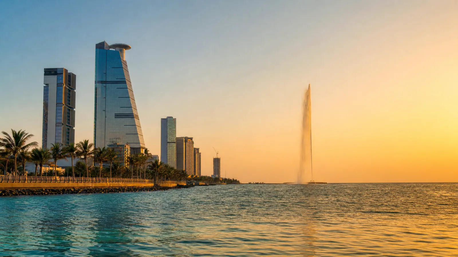 Jeddah Corniche waterfront in Saudi Arabia at golden hour, with the King Fahd Fountain on the Red Sea